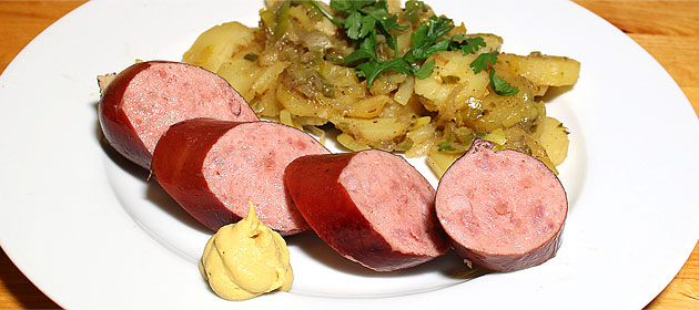 OLMA-Schüblig mit geschmorten Lauch-Kartoffeln